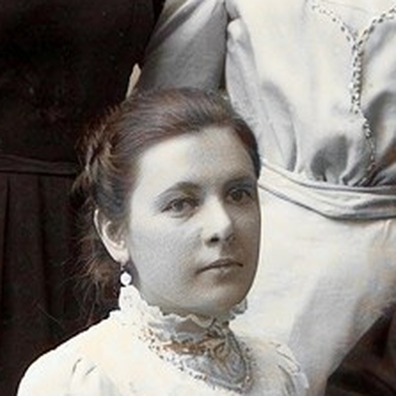 First restore: a young, round-faced woman with dark hair and an earring